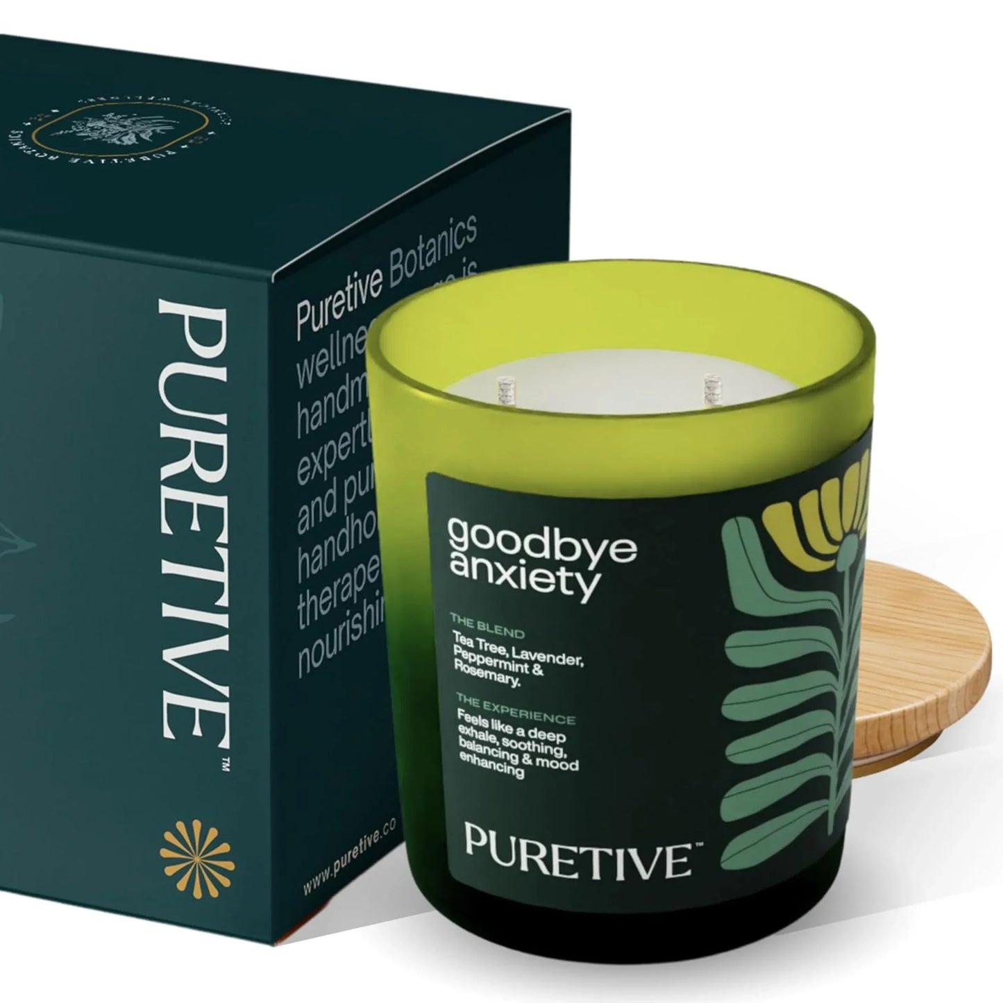 Aromatic candle with 'goodbye anxiety' label next to its box on a white background.