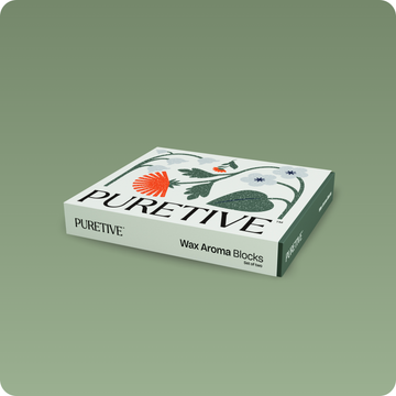 A box of Puretive Wax Aroma Blocks with floral design on a green background.