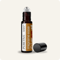 Brown essential oil roller bottle labeled 