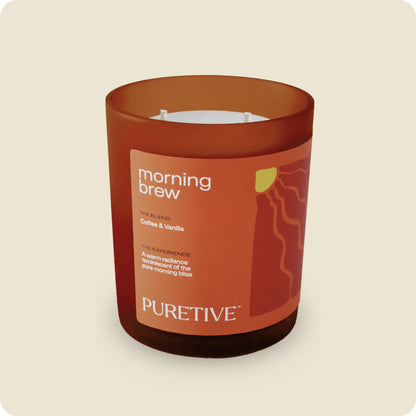 Scented candle labeled "morning brew" with coffee and vanilla blend by 'PURETIVE'.